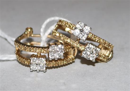 A pair of 14ct gold and diamond stud earrings, each with 8 small diamonds in offset square settings, gross 4.5gr